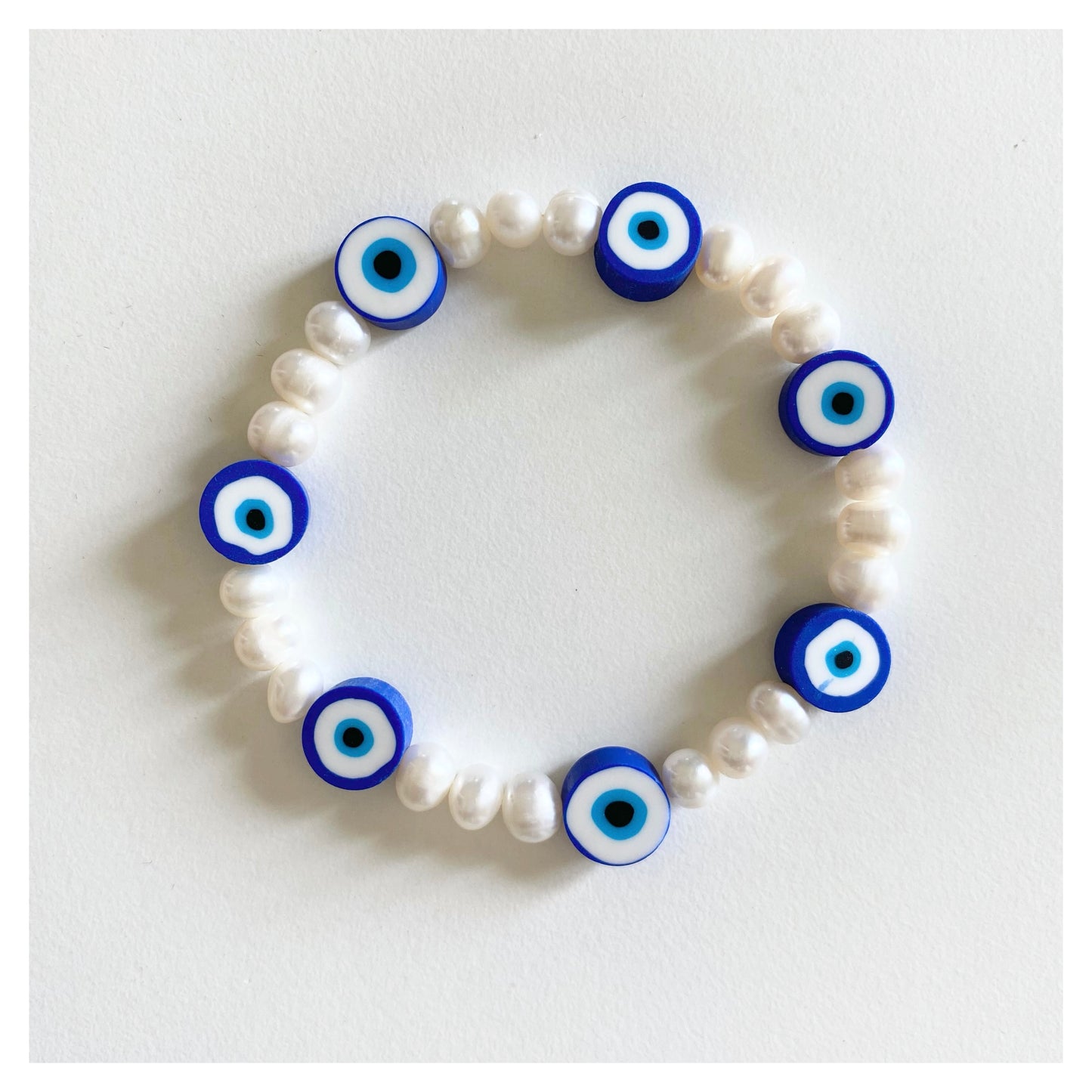 Pearl + Evil Eye Bracelet